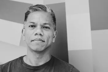 Black-and-white portrait of Gerald Casel