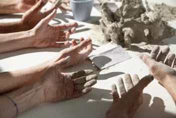 Photo of hands that have worked with clay