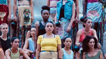 A photo of women, some of whom are sitting and others standing, in Mexico