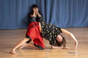 Photo of a dance workshop featuring two dancers. 