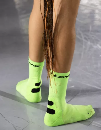photo of lower legs wearing fluorescent green socks