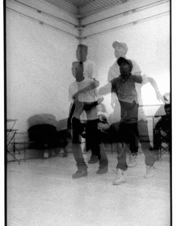 Black-and-white photograph featuring two dancers