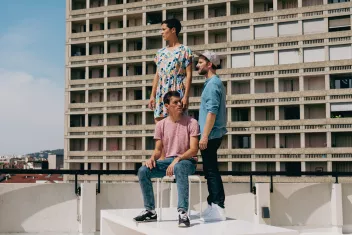 Photo of the three members of the A/R Collective on the roof of a building 