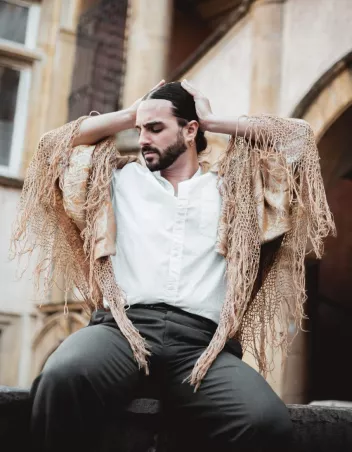 Photo of Paul de Saint Paul sitting with his hands behind his head